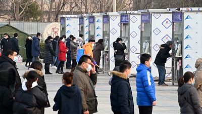Beijing residents being tested for Covid-19 at a mass testing site.