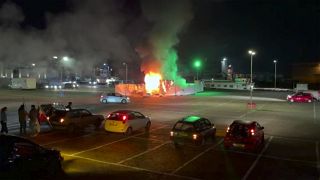 In this image made from video, a COVID-19 testing center is seen after being set on fire in Urk, 80 kilometres northeast of Amsterdam, Jan. 23, 2021.