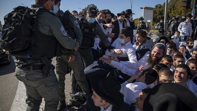 Israeli police officers clash with ultra-Orthodox Jews in Ashdod, Israel.