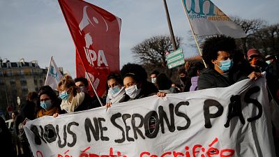 Students demonstrate with a banner reading "We will not be the the sacrificed generation", Jan. 20, 2021 in Paris.