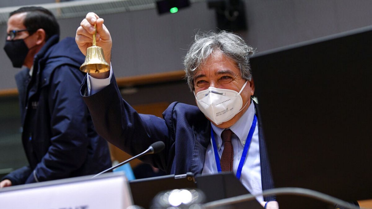 Portuguese Minister of Sea Ricardo Serrao Santos rings a bell during a EU Agriculture and Fisheries Ministers video conference meeting in Brussels, Monday, Jan. 25, 2021.