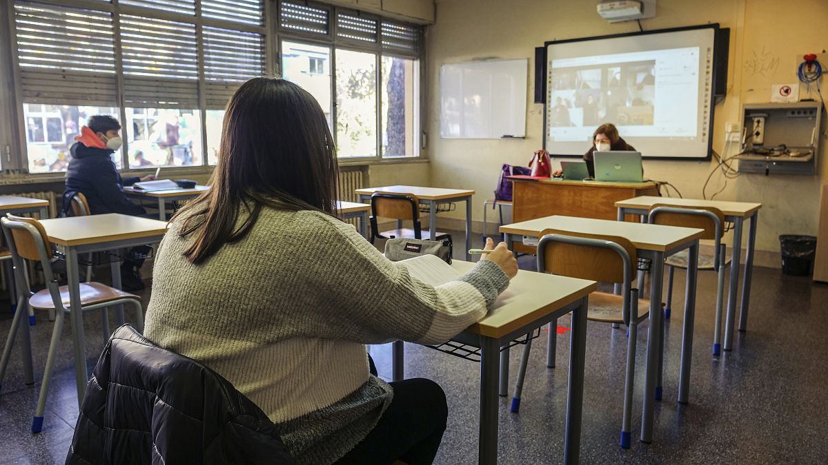 Students attend class at a high school in Rome, Monday, Jan. 18, 2021.