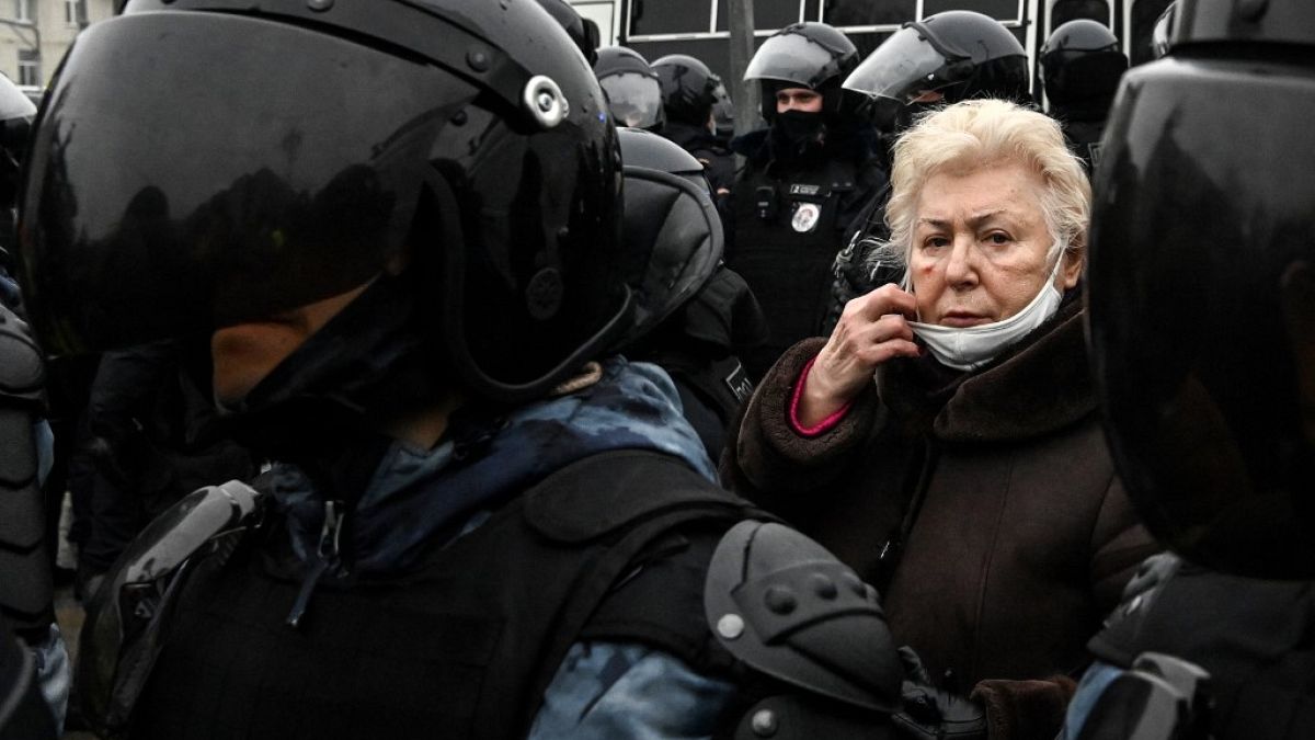 An elderly woman attends a rally in support of jailed opposition leader Alexei Navalny in downtown Moscow on January 23