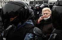 An elderly woman attends a rally in support of jailed opposition leader Alexei Navalny in downtown Moscow on January 23