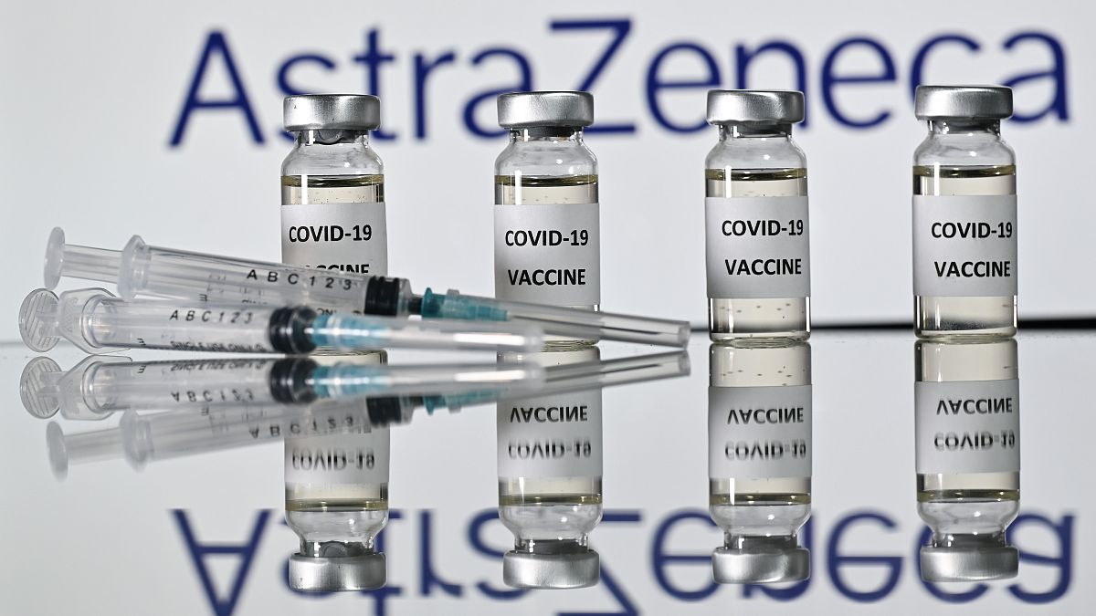An illustration picture shows vials with Covid-19 Vaccine stickers attached and syringes with the logo of British pharmaceutical company AstraZeneca on November 17, 2020. 