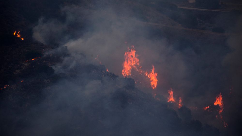 Watch: An unknown source fire ravages a mountainous region in Argentina