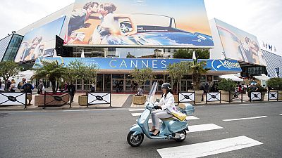 A scooter drives by the Palais des Festivals at the 71st international film festival, Cannes, southern France, on May 7, 2018.