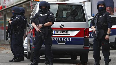 FILE - Police officers guard the scene in Vienna, Austria, Tuesday, Nov. 3, 2020.