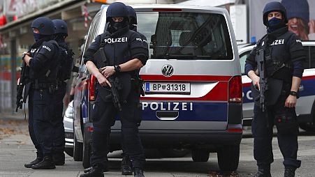 FILE - Police officers guard the scene in Vienna, Austria, Tuesday, Nov. 3, 2020.