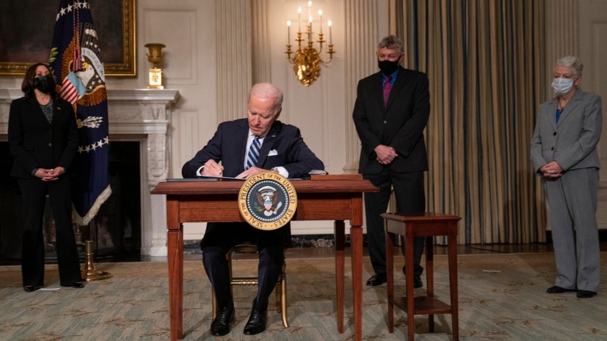 President Joe Biden signs a series of executive orders on climate change, in the State Dining Room of the White House, Wednesday, Jan. 27, 2021, in Washington. 