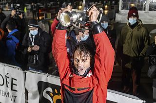 France's Yannick Bestaven lifts the trophy after winning the Vendee Globe solo around-the-world sailing race, in Les Sables-d'Olonne, France, early Thursday, Jan.28, 2021.
