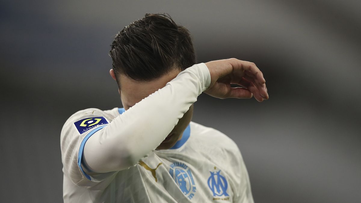 Marseille's Florian Thauvin reacts during the French League One soccer match between Marseille and Lens at the Veledrome stadium in Marseille, France, Wednesday, Jan. 20, 2021