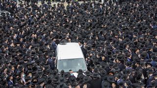 Thousands of ultra-Orthodox Jews participate in the funeral for prominent rabbi Meshulam Soloveitchik, in Jerusalem, Sunday, Jan. 31, 2021.