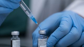 In this Jan. 12, 2021 file photo, a health care professional prepares a Pfizer-BioNTech COVID-19 vaccine at Sheba Tel Hashomer Hospital in Ramat Gan, Israel.