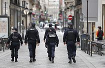 Police officers patrol near Le Printemps shopping centre in Paris as big shopping centres are closed as a measure taken to curb the spread of the Covid-19