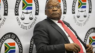 South Africa's Zuma defies corruption probe by keeping silent