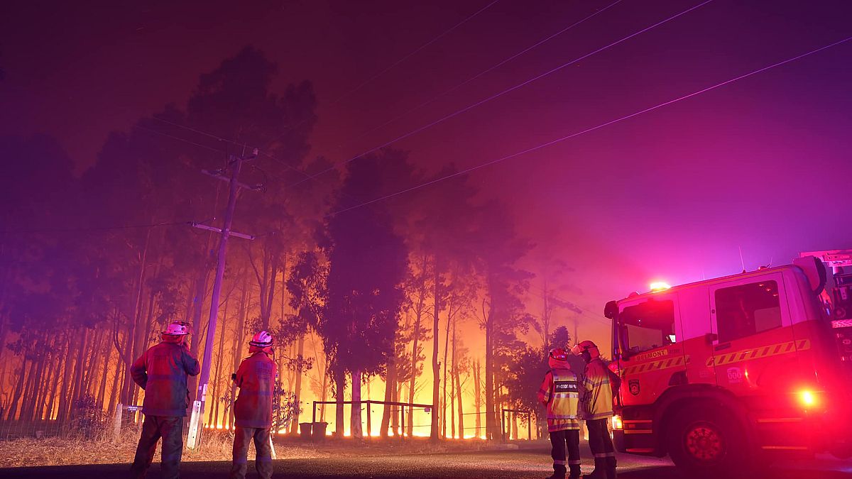 Firefighters attend a fire at Wooroloo, near Perth, Australia, Monday, Feb. 1, 2021. 