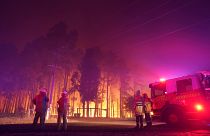 Firefighters attend a fire at Wooroloo, near Perth, Australia, Monday, Feb. 1, 2021.