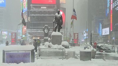 New Yorkers brave the snow storm on Times Square