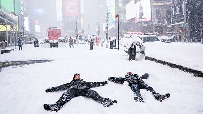 People make 'snow angels' during a snowstorm in Times Square, New York City People make 'snow angels' during a snowstorm in Times Square, New York City