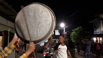 Yangon residents protest against the coup by banging pots and pans