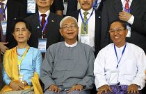 In this May 24, 2017, file photo, Myanmar's Vice President Myint Swe (R) sits with State Counsellor Aung San Suu Kyi (L) and then-President Htin Kyaw in Myanmar.