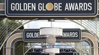 FILE - Event signage appears above the red carpet at the 77th annual Golden Globe Awards, Sunday, Jan. 5, 2020, in Beverly Hills, Calif. 