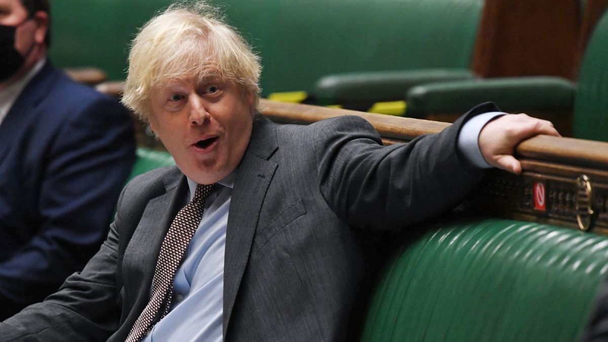 In this handout photo provided by UK Parliament, Britain's Prime Minister Boris Johnson looks on during Prime Minister's Questions in the House of Commons, London, Wednesday, 