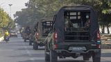 A convoy of army vehicles patrol the streets in Mandalay, Myanmar, Wednesday, Feb. 3, 2021.