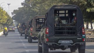 A convoy of army vehicles patrol the streets in Mandalay, Myanmar, Wednesday, Feb. 3, 2021.