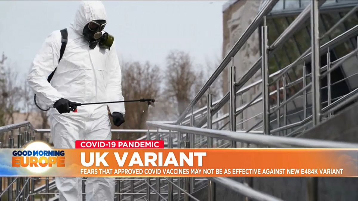 Man in hazmat suit cleans handrail in UK