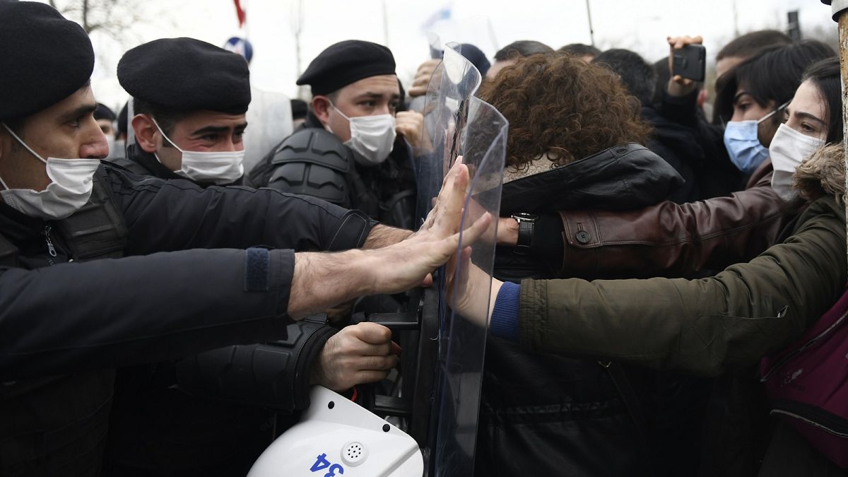 Turkish police officers clash with students of the Bogazici University protesting the appointment of a government loyalist to head their university, in Istanbul.