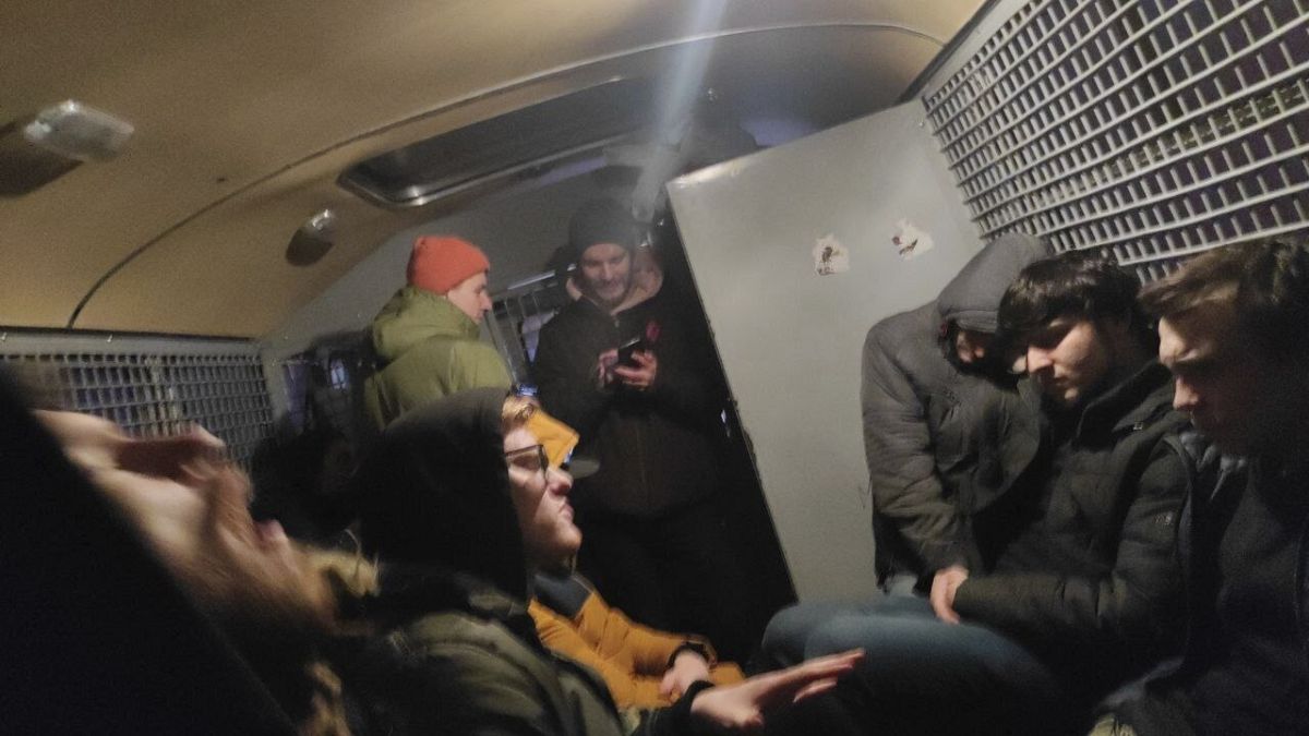 This photo released by Philipp Kyznetsov shows a group of detained people inside the police bus in Moscow, Russia