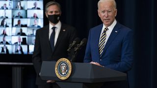 Secretary of State Antony Blinken listens as President Joe Biden delivers remarks to State Department staff, Thursday, Feb. 4, 2021, in Washington. 