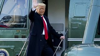 Donald Trump waves as he boards Marine One on the South Lawn of the White House, in Washington, en route to his Mar-a-Lago Florida Resort. Jan. 20, 2021.