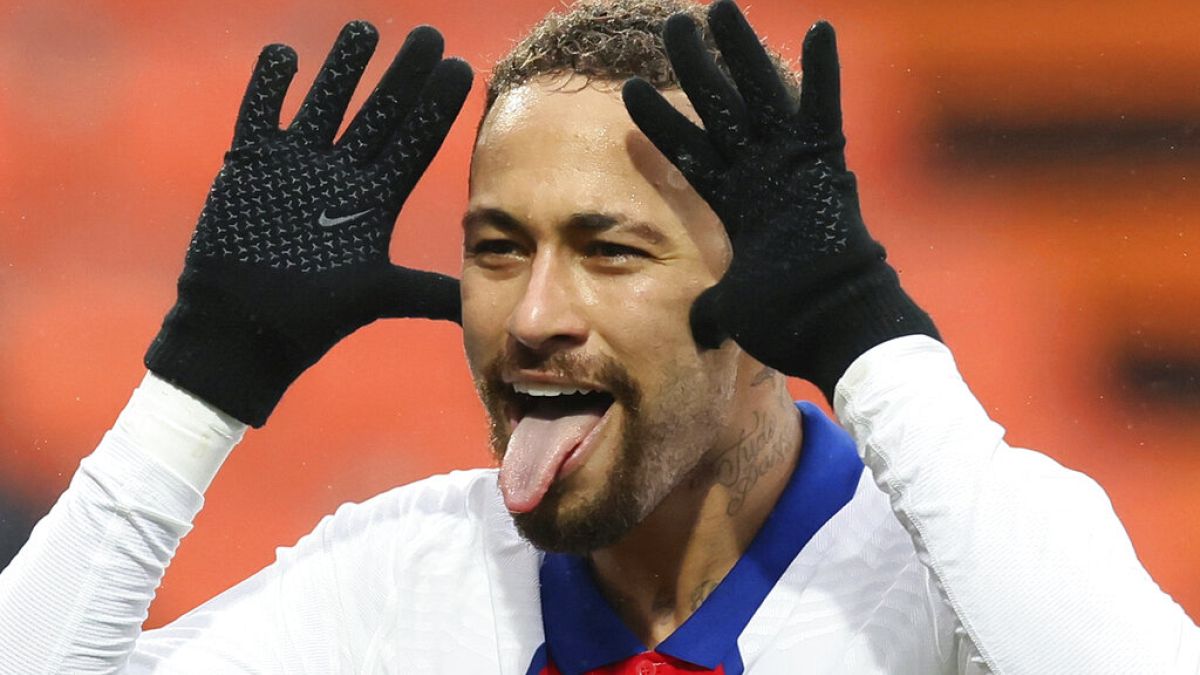 PSG's Neymar celebrates after scoring his side's second goal during the French League One football match between FC Lorient and Paris Saint-Germain