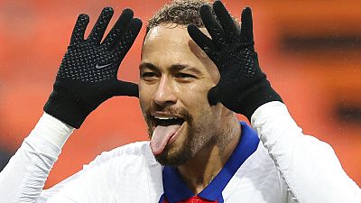 PSG's Neymar celebrates after scoring his side's second goal during the French League One football match between FC Lorient and Paris Saint-Germain