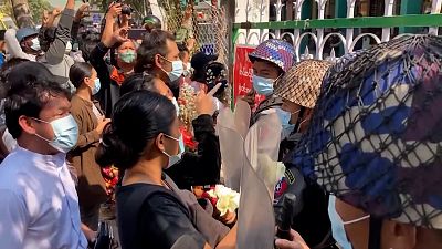 Activists' backers bring flowers to Myanmar court