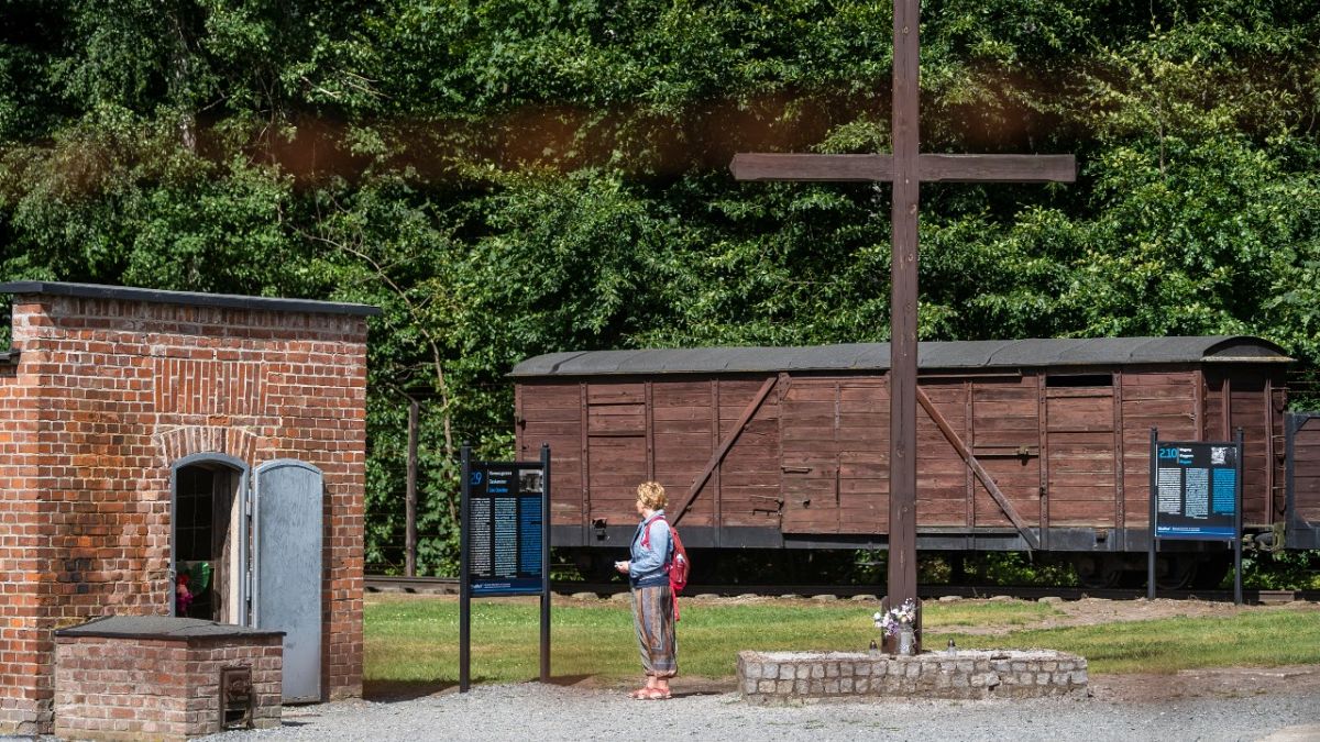 A woman is seen next to a gas chamber at the museum of the former Nazi Death Camp Stutthof, in Sztutowo, July 21, 2020. 