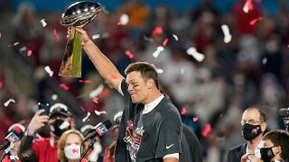 Tampa Bay Buccaneers quarterback Tom Brady celebrates with the Vince Lombardi Trophy after the NFL Super Bowl 55