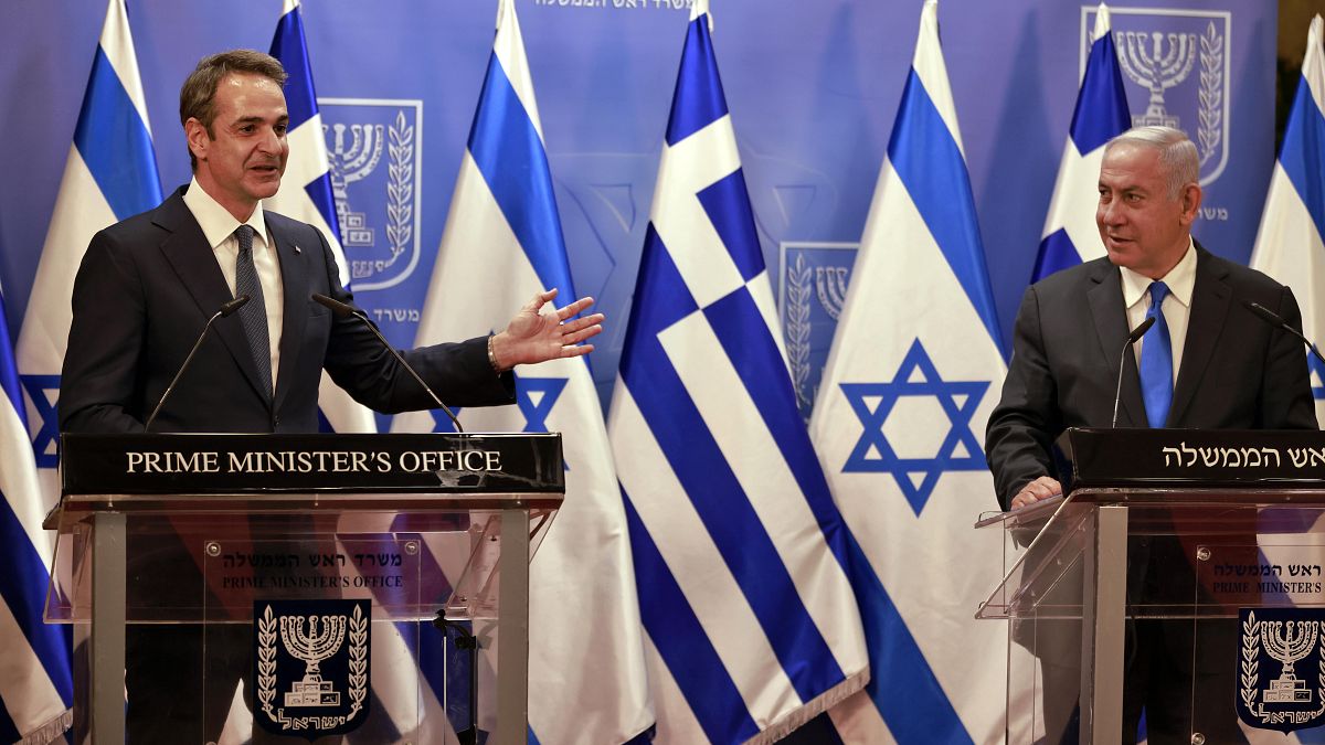 Greek Prime Minister Kyriakos Mitsotakis, left, and Israeli Prime Minister Benjamin Netanyahu deliver statements in Jerusalem, Monday, Feb. 8, 2021. 