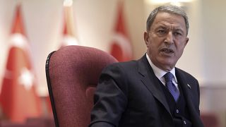 Turkish Defense Minister Hulusi Akar speaks during a news conference in Ankara.