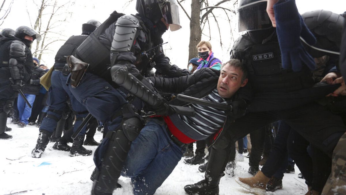Police detain protesters during a protest against the jailing of opposition leader Alexei Navalny in St. Petersburg, Russia