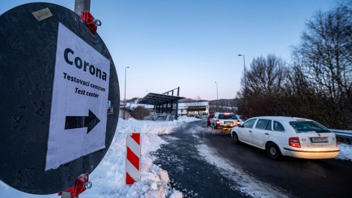 Cars queue in front of a Corona test station at the German-Czech Republic border in Furth im Wald, Germany, Monday, Jan. 25, 2021. 