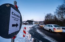 Cars queue in front of a Corona test station at the German-Czech Republic border in Furth im Wald, Germany, Monday, Jan. 25, 2021.