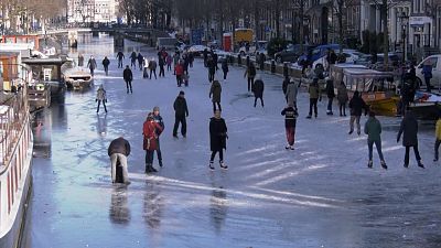 Dozens of skaters took to the frozen surface of Amsterdam's historic Prinsengracht canal on Saturday