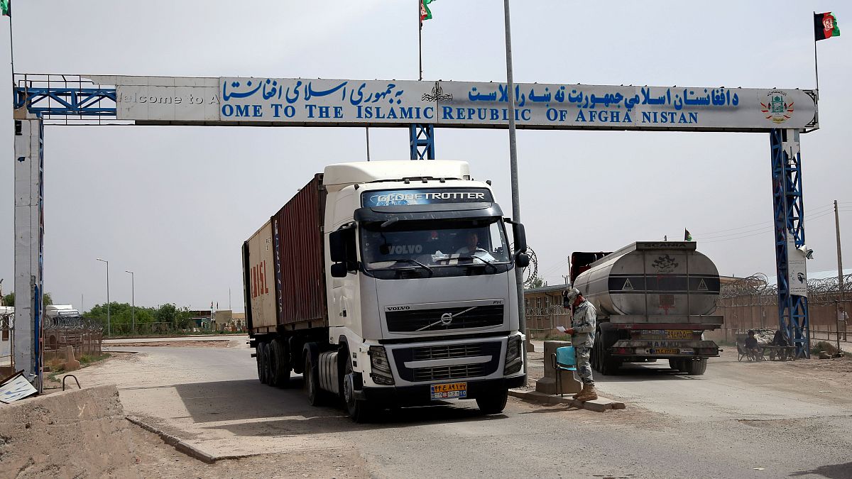 In this April 13, 2015 photo, an Afghan border policeman mans a checkpoint at the Afghan-Iranian border point near Islam Qala in Herat province, west of Kabul, Afghanistan.