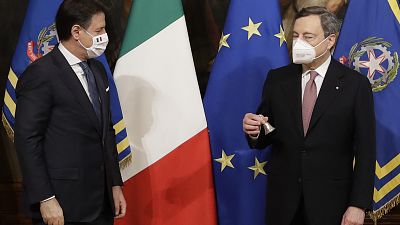 Italian outgoing Premier Giuseppe Conte handed over the cabinet minister bell to new Premier Mario Draghi, during the handover ceremony at Chigi Palace