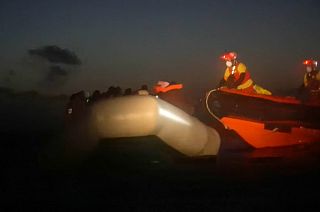 Open Arms rescue workers approach stranded migrants