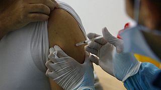 a Moroccan nurse administers the Oxford AstraZeneca COVID-19 vaccine to a health worker, at Cheikh Khalifa Hospital in Casablanca, Morocco. 